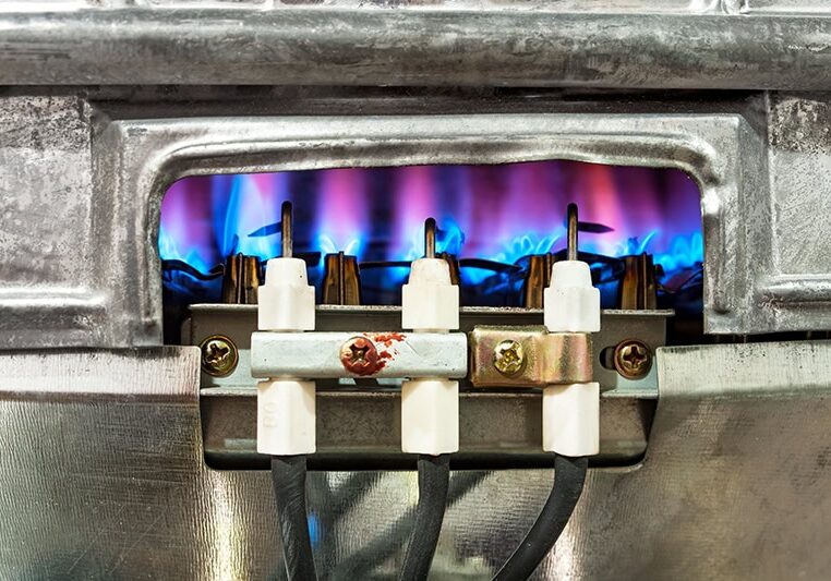 close-up of a gas furnace pilot light.