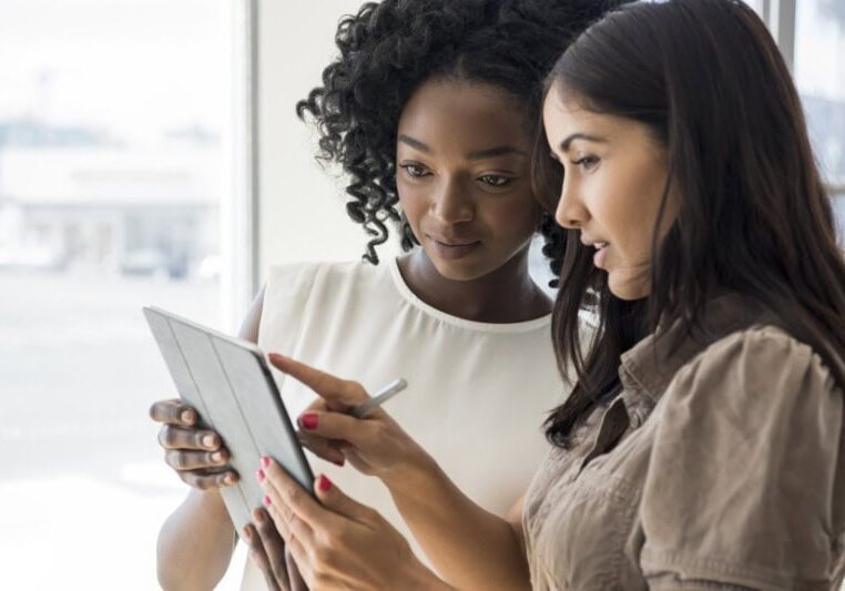 What Is a Dual Fuel Heating System? Women looking at device with serious expression.