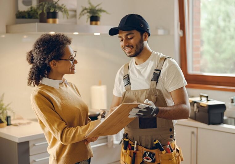 Male plumber or repairman close deal with female client after work or fix at home