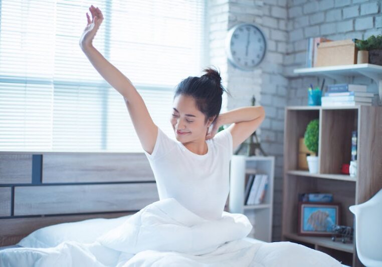 Asian women She is in bed and was waking up in the morning. She felt very refreshed.