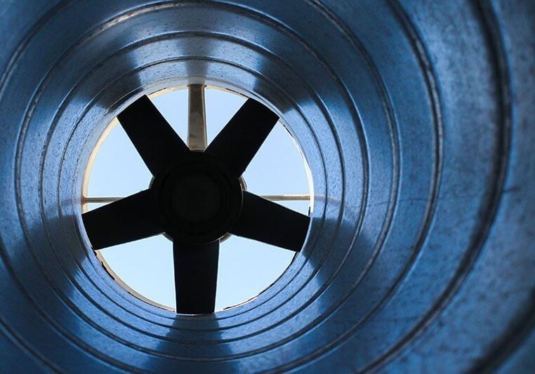 Deodorizing and Disinfecting Your Air Ducts. Close up photo of an air vent on the inside looking out of a fan.